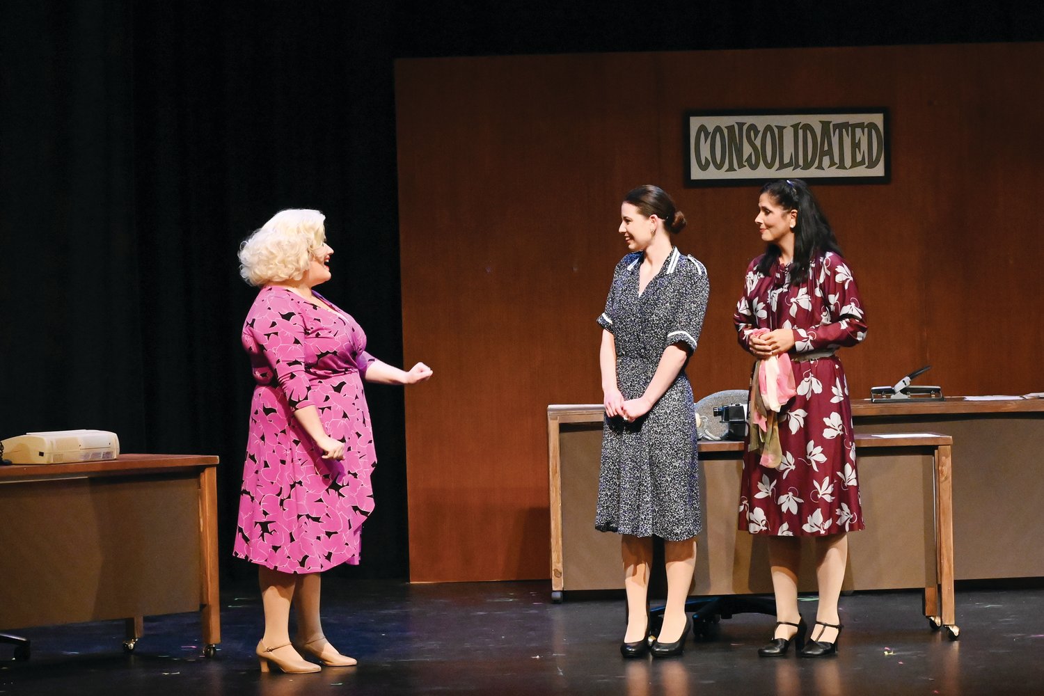 UNLIKELY FRIENDS: Three coworkers at Consolidated Industries become unlikely friends and seek revenge on their boss. From left: Kaelyn Boss of Glocester as Doralee, Becky Minda of Providence as Judy, and Lia Del Sesto McAlpine of Cranston as Violet.